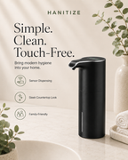 Black Hanitize touchless soap dispenser on a modern bathroom countertop with towels, plants and minimalist décor.