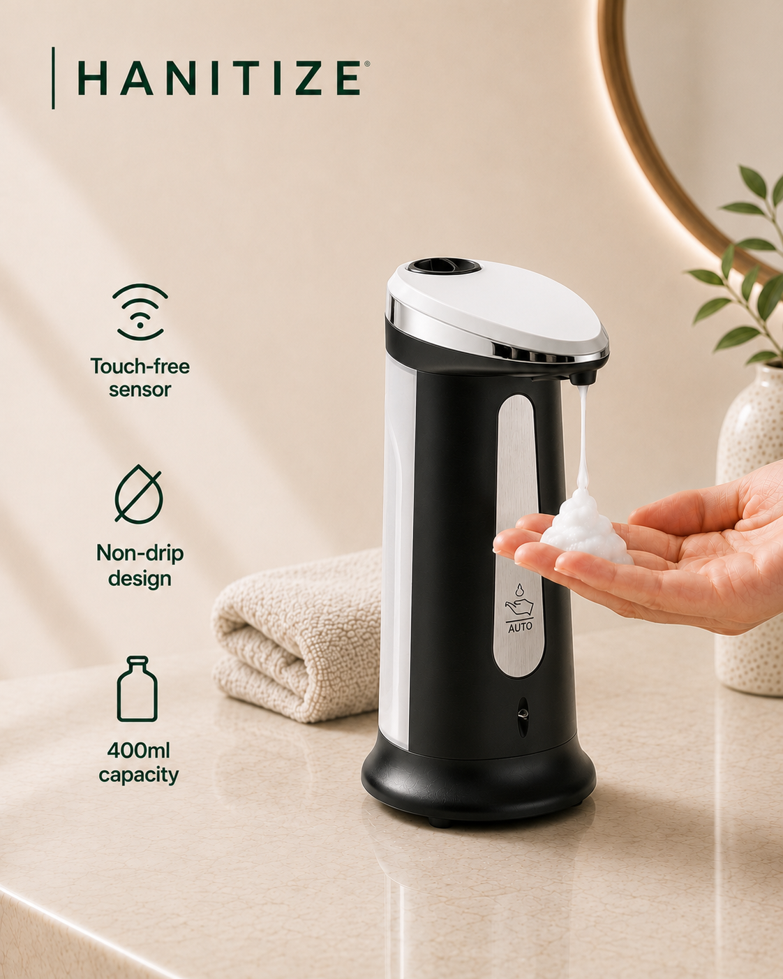 Black Hanitize touchless soap dispenser dispensing foam into a hand, with a non-drip design and 400ml capacity.