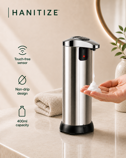 Stainless steel Hanitize touchless soap dispenser dispensing foam into a hand, with a non-drip design and 400ml capacity.